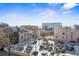 Exterior view from above with parking and city buildings in the background at 888 N Logan St # 5A, Denver, CO 80203