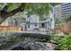 A spacious backyard with a patio, fire pit, and mature trees, perfect for outdoor entertaining at 1315 Gaylord St, Denver, CO 80206
