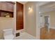 Bathroom featuring wood cabinetry, built-in storage, and classic mosaic tile flooring at 1315 Gaylord St, Denver, CO 80206