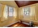 Bedroom featuring light yellow walls, hardwood floors and 3 windows providing natural light at 1315 Gaylord St, Denver, CO 80206