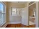 Bright bedroom with hardwood floors and windows with wood shutters at 1315 Gaylord St, Denver, CO 80206