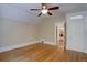 An empty bedroom with hardwood floors and a ceiling fan at 1315 Gaylord St, Denver, CO 80206