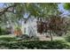 This home is surrounded by a lush yard featuring gorgeous mature trees at 1315 Gaylord St, Denver, CO 80206