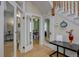 This home features a bright foyer with wooden floors, a staircase and glass paned doors at 1315 Gaylord St, Denver, CO 80206