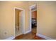 Hallway with access to the piano room and bathroom, both featuring classic design elements at 1315 Gaylord St, Denver, CO 80206