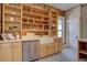 Renovated kitchen with exposed brick, custom cabinets and farmhouse sink at 1315 Gaylord St, Denver, CO 80206