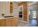 Spacious kitchen featuring exposed brick, modern appliances, and an inviting open layout at 1315 Gaylord St, Denver, CO 80206