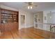 Open landing featuring wood floors, built-in shelves, and staircase at 1315 Gaylord St, Denver, CO 80206