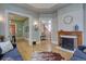 This home features a cozy living room with a fireplace and hardwood floors at 1315 Gaylord St, Denver, CO 80206