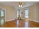 Sun-filled living room with wood floors, ceiling fan, and neutral-toned walls at 1315 Gaylord St, Denver, CO 80206