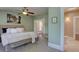 Airy main bedroom with serene paint and an adjacent bathroom at 1315 Gaylord St, Denver, CO 80206