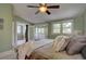 Comfortable main bedroom with an adjacent porch and a ceiling fan at 1315 Gaylord St, Denver, CO 80206