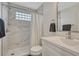 Well-lit bathroom with modern tile shower, updated vanity, and contemporary fixtures at 12521 S Elk Creek Way, Parker, CO 80134