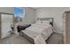 Bright bedroom featuring neutral color scheme, plush carpeting, and a large mirrored closet at 12521 S Elk Creek Way, Parker, CO 80134