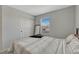 Bedroom with neutral decor, plush carpeting, and a mirrored closet providing ample storage space at 12521 S Elk Creek Way, Parker, CO 80134