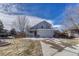 Charming two-story home boasts an attached two-car garage and inviting front porch at 12521 S Elk Creek Way, Parker, CO 80134