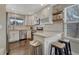 Stylish kitchen with white cabinets, subway tile backsplash, and stainless steel appliances at 12521 S Elk Creek Way, Parker, CO 80134