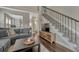 Comfortable living room with carpet and hardwood floors, staircase, and natural light at 12521 S Elk Creek Way, Parker, CO 80134