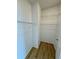 Spacious walk-in closet with wall to wall shelving and hardwood flooring at 8362 Jasmine St, Commerce City, CO 80022