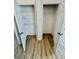 Double closets with open doors, shelving, and hardwood flooring at 8362 Jasmine St, Commerce City, CO 80022