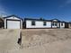 Charming home featuring a detached garage and rock landscaping for easy maintenance at 8362 Jasmine St, Commerce City, CO 80022