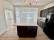 Kitchen island offers lots of workspace and views to the living room at 8362 Jasmine St, Commerce City, CO 80022