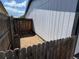 Side yard featuring a new fence and ample room for landscaping at 8362 Jasmine St, Commerce City, CO 80022