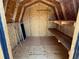 Interior of a storage shed featuring ample storage space and plank flooring at 8362 Jasmine St, Commerce City, CO 80022
