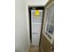 Furnace in a small closet with wood door and an energy guide label at 8362 Jasmine St, Commerce City, CO 80022
