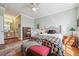 Cozy bedroom with a ceiling fan, decorative quilt, and ample natural light at 10007 Martin Luther King Blvd # 104, Denver, CO 80238