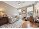 A versatile room featuring two windows, hardwood floors, and modern decor at 10007 Martin Luther King Blvd # 104, Denver, CO 80238