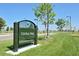 View of community park with sign, mature trees, and well-maintained green spaces at 10007 Martin Luther King Blvd # 104, Denver, CO 80238