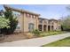 Attractive multi-story building exterior with red shutters, balconies, and well-maintained landscaping at 10007 Martin Luther King Blvd # 104, Denver, CO 80238