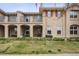Charming multi-story home with a balcony, porch, and well-maintained landscaping at 10007 Martin Luther King Blvd # 104, Denver, CO 80238