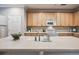 Spacious kitchen island with sink and ample countertop space, great for meal prep at 10007 Martin Luther King Blvd # 104, Denver, CO 80238
