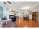 Combined living spaces, featuring hardwood floors, a fireplace, kitchen, and dining area at 10007 Martin Luther King Blvd # 104, Denver, CO 80238