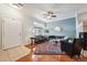 Comfortable living room with fireplace, ceiling fan, stylish rug, and plenty of natural light at 10007 Martin Luther King Blvd # 104, Denver, CO 80238