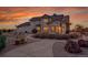 Spacious backyard with a stone patio, built-in grill, and manicured landscaping, perfect for outdoor entertaining at 1012 S Addison Way, Aurora, CO 80018