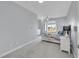 This bedroom features soft gray walls, plush carpet, and a cozy window nook, creating a peaceful retreat at 1012 S Addison Way, Aurora, CO 80018