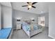 Relax in this bedroom featuring a ceiling fan, plush carpet, and a cozy window seat at 1012 S Addison Way, Aurora, CO 80018