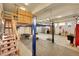 This spacious garage offers ample storage and a car lift, catering to car enthusiasts at 1012 S Addison Way, Aurora, CO 80018