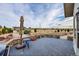 An open patio with stone accents offers serene outdoor space and views of the sprawling backyard at 1012 S Addison Way, Aurora, CO 80018