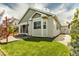 Exterior back view of home featuring patio and lush green lawn at 1171 Nathan Pl, Erie, CO 80026