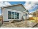 Backyard with sliding glass door and concrete patio at 1171 Nathan Pl, Erie, CO 80026