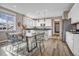 Spacious kitchen with modern appliances, an island, and a dining area at 1171 Nathan Pl, Erie, CO 80026