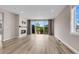 Open living room with a fireplace, and sliding glass doors that bring the outdoors in at 1171 Nathan Pl, Erie, CO 80026