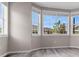 Bright room featuring large windows offering natural light and scenic neighborhood views at 1171 Nathan Pl, Erie, CO 80026
