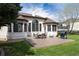 A backyard featuring a spacious patio, dining set, and grill, perfect for outdoor entertaining at 6271 S Billings Way, Centennial, CO 80111