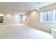 Bright, spacious basement area with recessed lighting and large windows for natural light at 6271 S Billings Way, Centennial, CO 80111