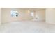 Open basement space with neutral carpeting and multiple windows offering ample sunlight at 6271 S Billings Way, Centennial, CO 80111